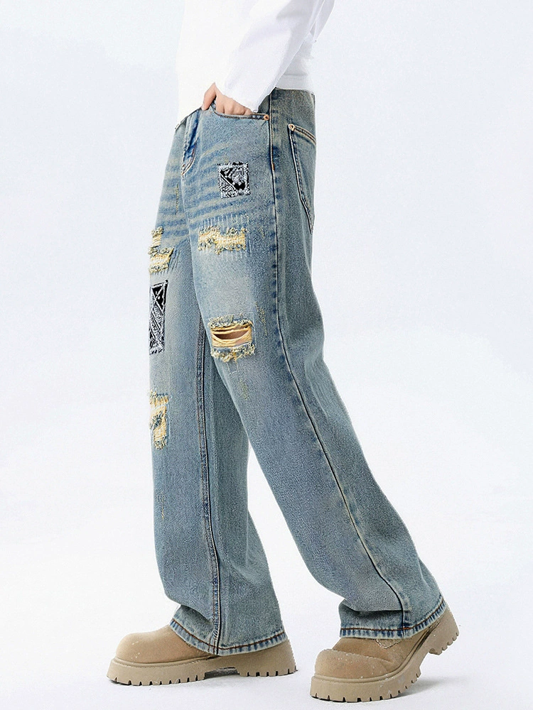 厂家直销男士宽松破洞贴布牛仔裤，休闲风格，水洗手工磨破设计