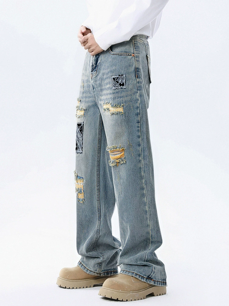 厂家直销男士宽松破洞贴布牛仔裤，休闲风格，水洗手工磨破设计