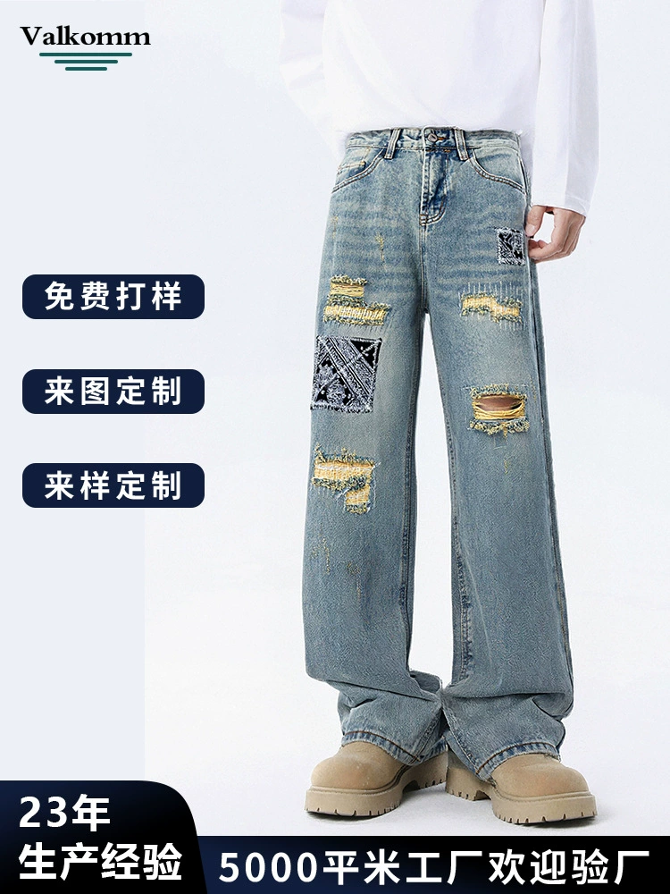 厂家直销男士宽松破洞贴布牛仔裤，休闲风格，水洗手工磨破设计